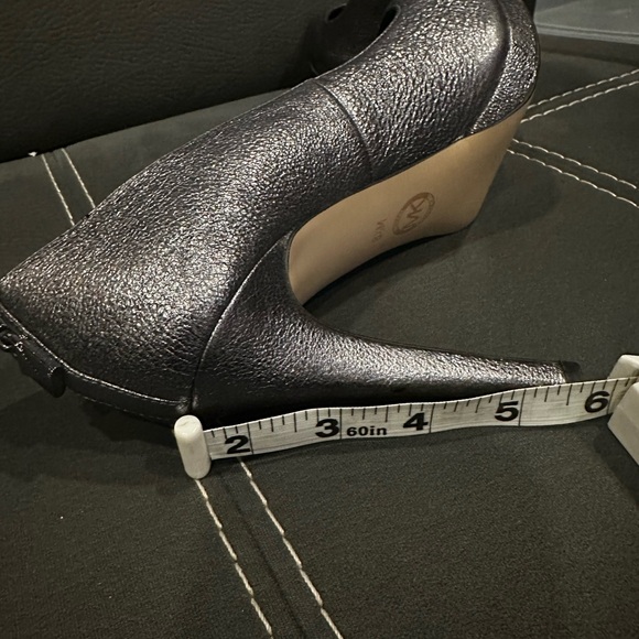 Silver Michael Kors pumps worn five times. Still like new. - Picture 3 of 4